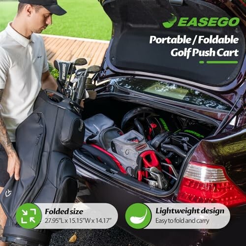 Man placing foldable golf push cart and golf bag into car trunk.