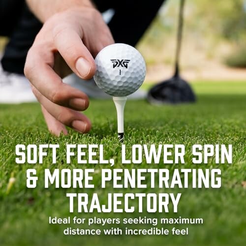 Hand placing golf ball on tee with text about soft feel and lower spin.