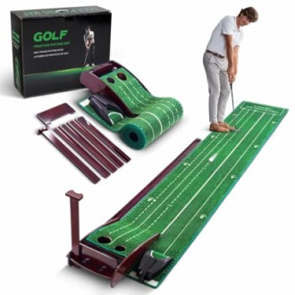 Man using a golf practice putting set with green mat and accessories.