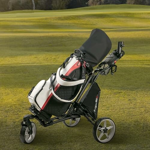 Golf push cart with bag on a grassy course