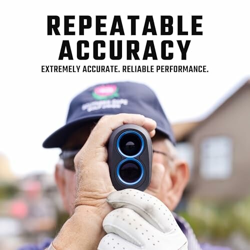 Golfer using a rangefinder for accuracy.