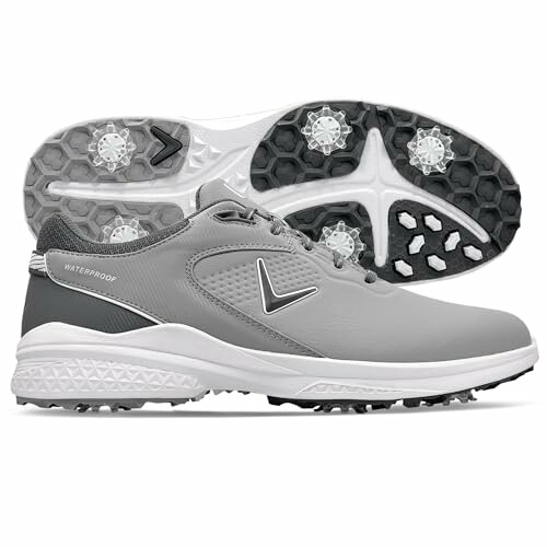 Gray waterproof golf shoes with spiked soles.