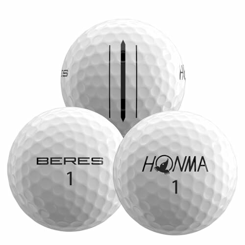 Three Honma Beres golf balls with logos and alignment marks, showcasing the premium quality and performance of the product.