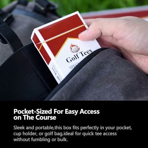 Hand holding a pocket-sized box of golf tees.