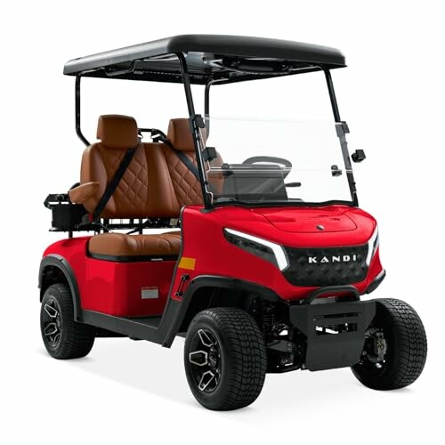 Red four-seater golf cart with roof and windshield.