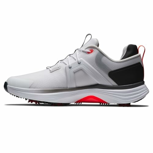 Side view of a white sports shoe with red and black accents.